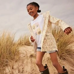 Barbour Girl's Printed Maar Showerproof Poncho 25 Barbour Girl's Printed Maar Showerproof Poncho -Farm House Tack Sales Shop SS23BarbourKids BarbourGirlsSophieTeeGTS0102WH11 BarbourGirlsPrintedMaaraShowerproofGSP0009OR12 BarbourGirlsEssentialDenimShortGST0001IN52 1